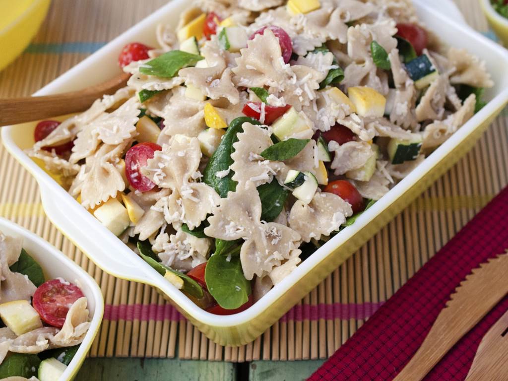 Summer Vegetable Ceasar Pasta Salad in a rectangular serving bowl